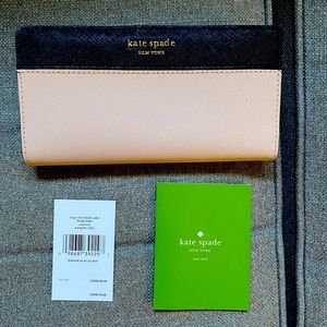 Kate spade wallet with tag and style tag.